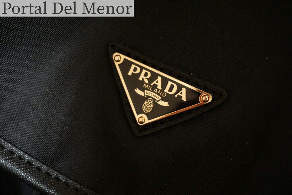 a prada logo on a black jacket